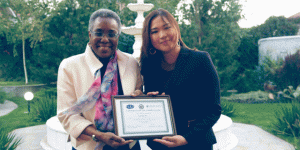 Nadezhda receives a certificate from the US Ambassador to Kyrgyzstan, Pamela L. Spratlen