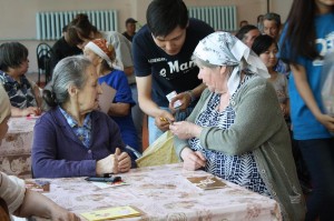 FLEX alumni visit with the resident and pass out medicine and other needed items on Victory Day.