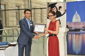 Nazrin Agharzayeva'13 receives her award from Fariz Ismayilzade'96-the founder of AAA