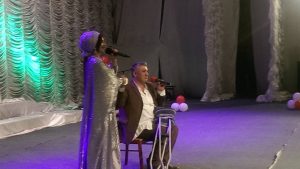 Tajikistan. Dushanbe.The most famous singer in Tajikistan-Shabnami Surayo singing with Muhammad Kholov during the charity concert.