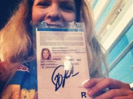 FLEX Alumni Volunteer at Sochi Winter Olympics 2014 Kristina Savchuk'13 with the autograph of Yuliya Lipnitskaya