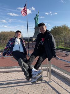 Students pose near the Statue of Liberty